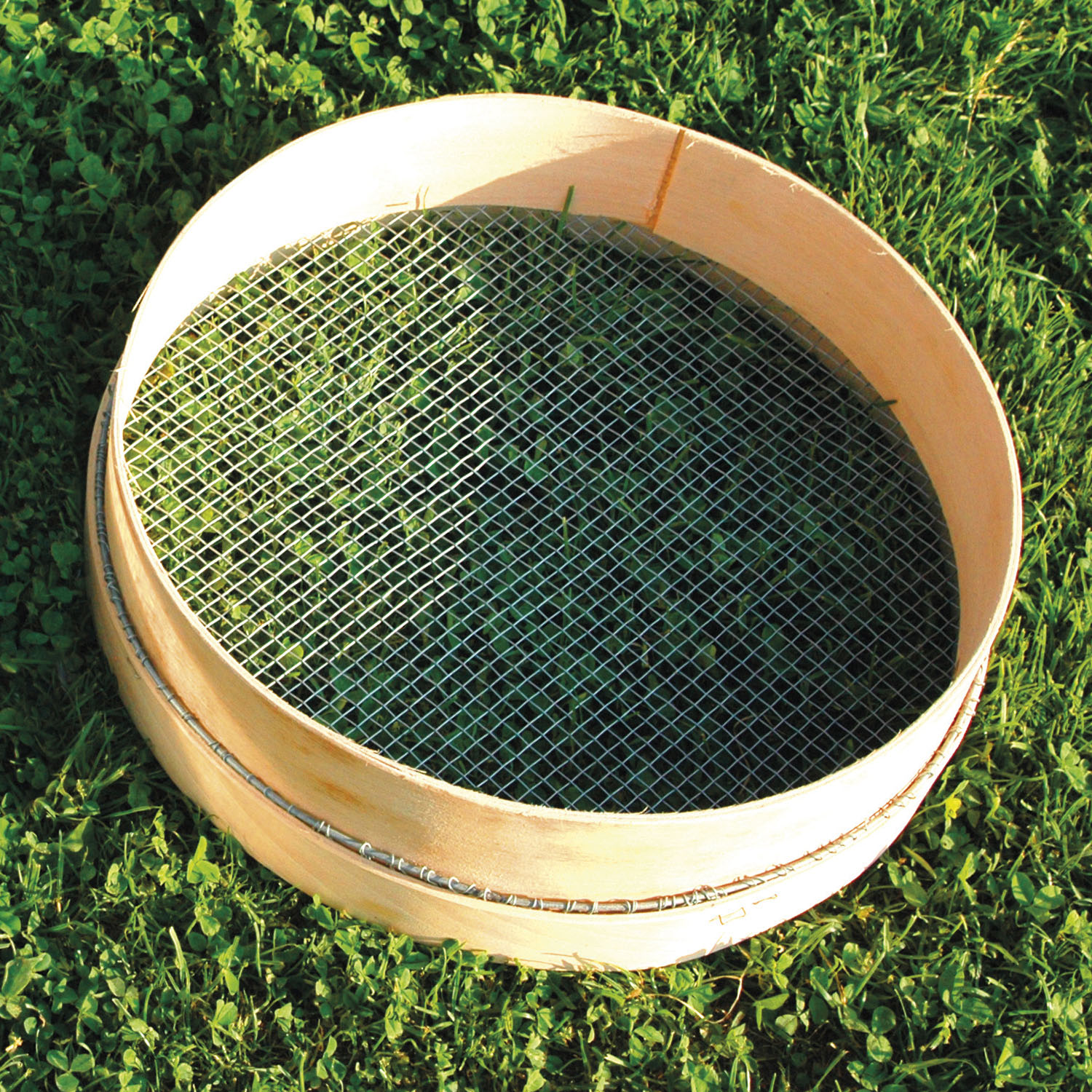Wooden rimmed sieve
